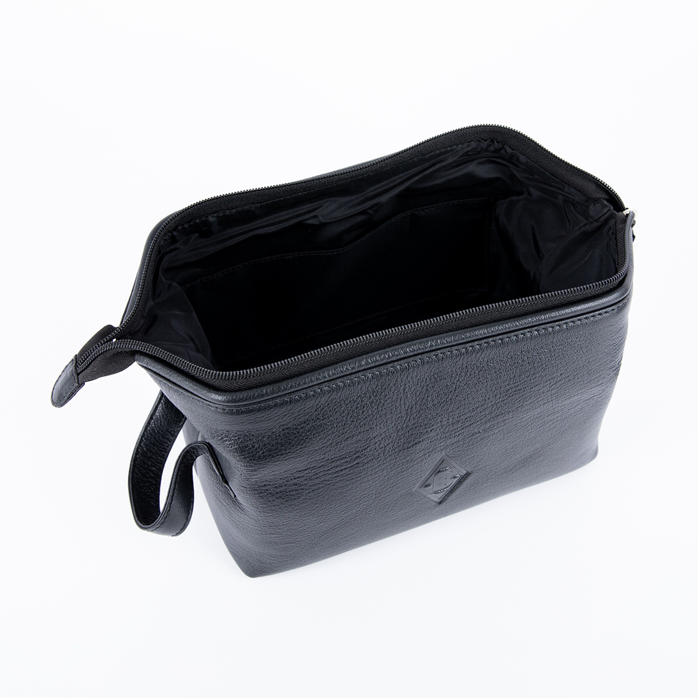 Schwarze Kosmetiktasche aus Leder mit Reißverschluss und einem einzigen Innenraum.