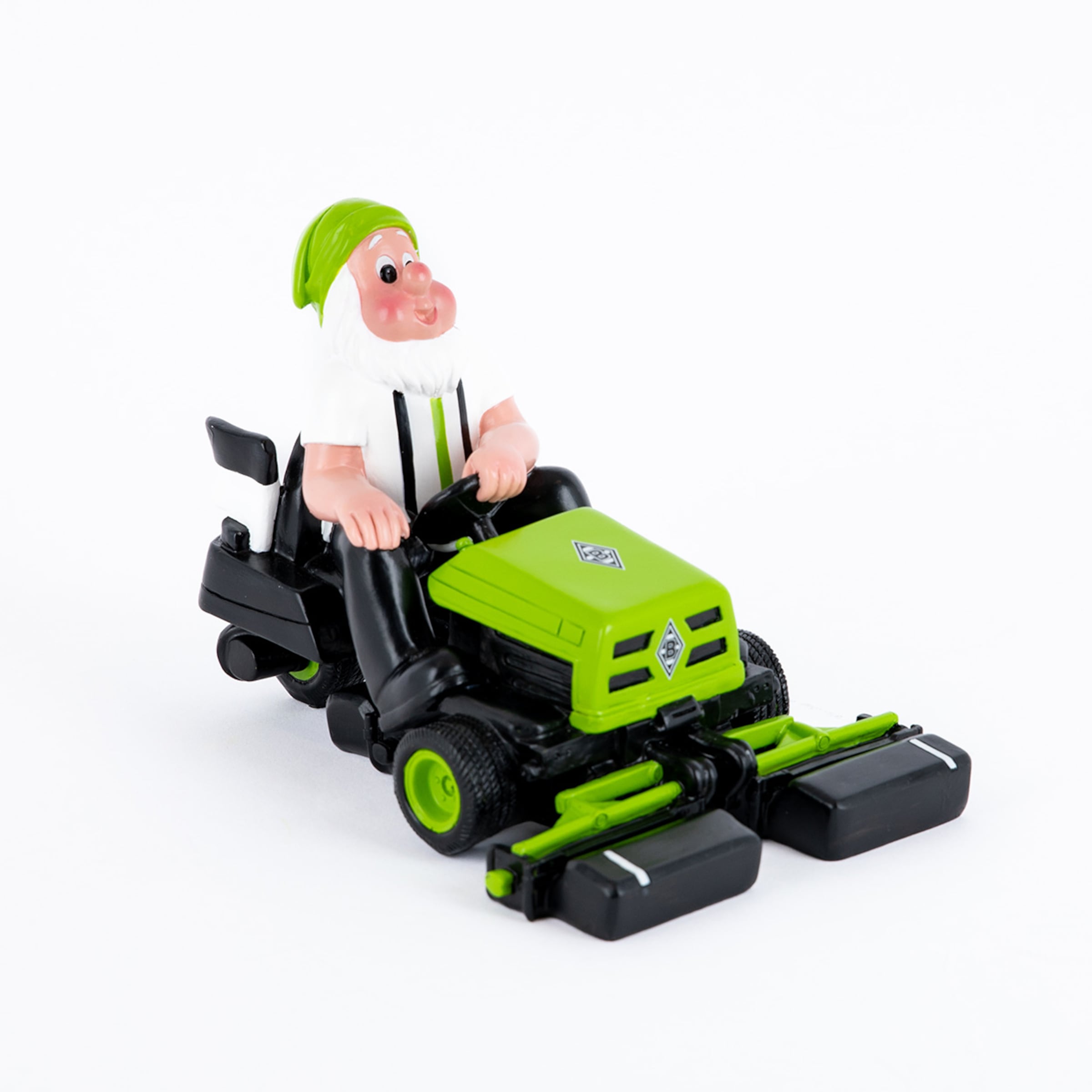 Ein grüner Rasentraktor mit einer Figur eines Gärtners in Borussia Mönchengladbach-Trikots.
