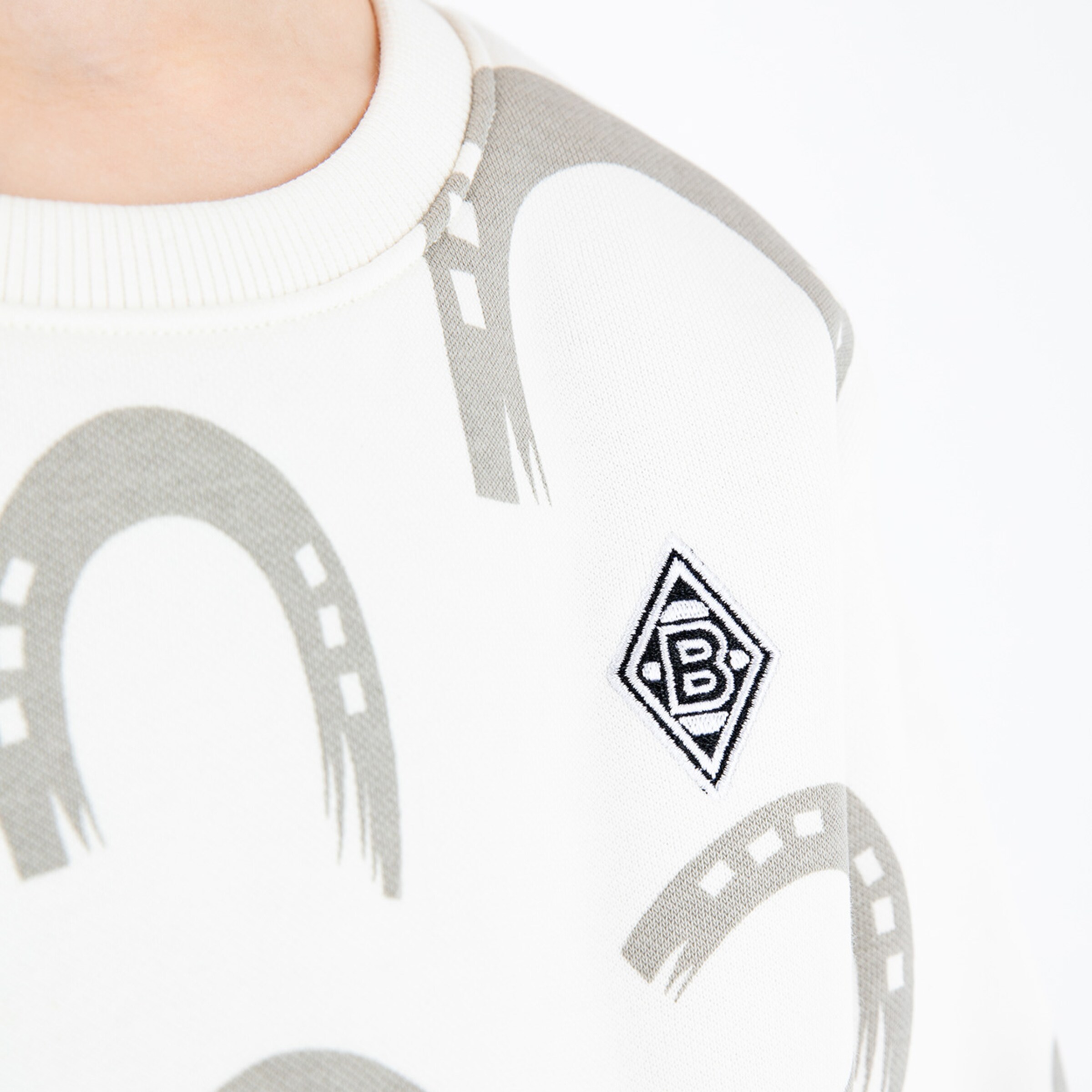 Close-up of a top featuring the Borussia Mönchengladbach logo.