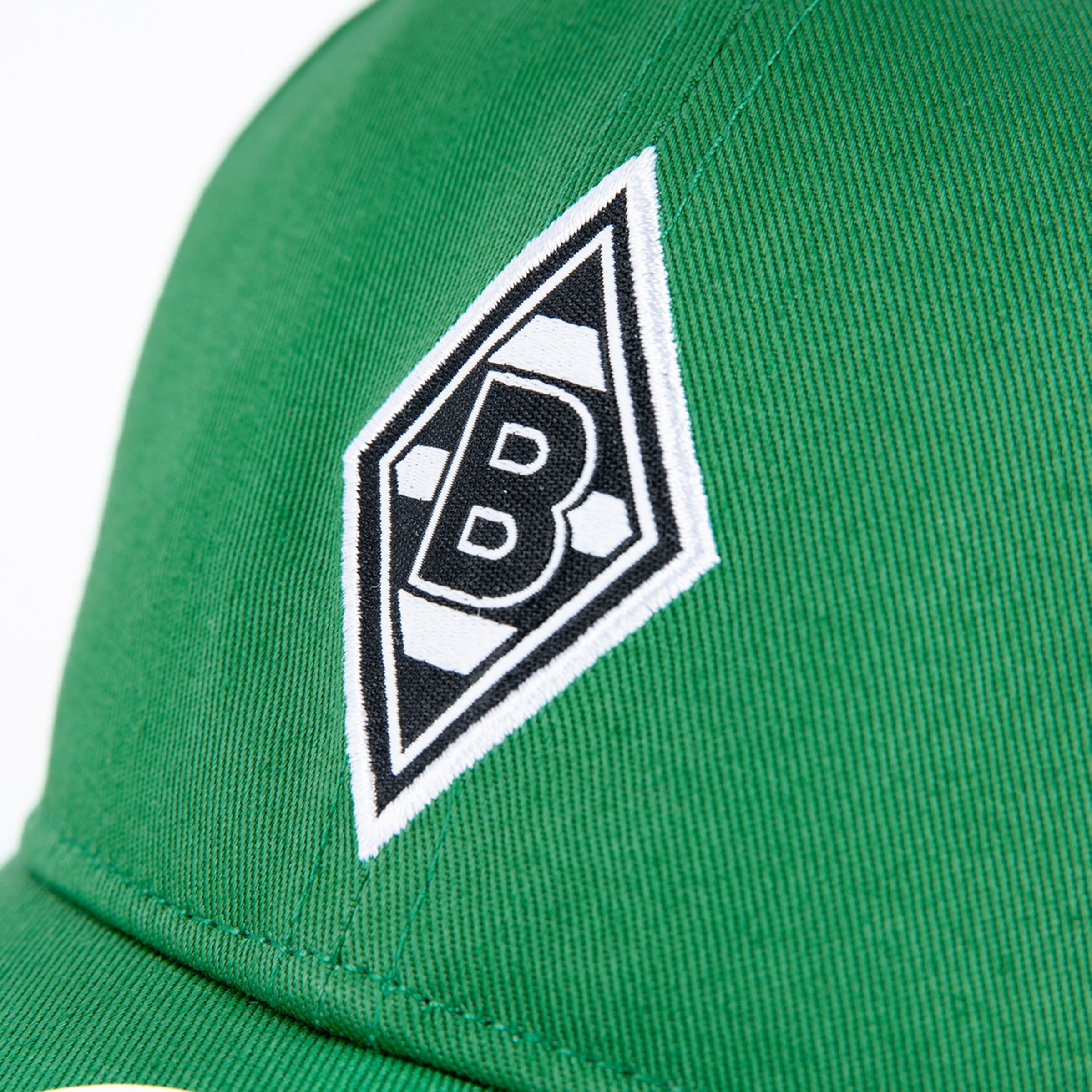 Green cap featuring Borussia Mönchengladbach logo in black and white.