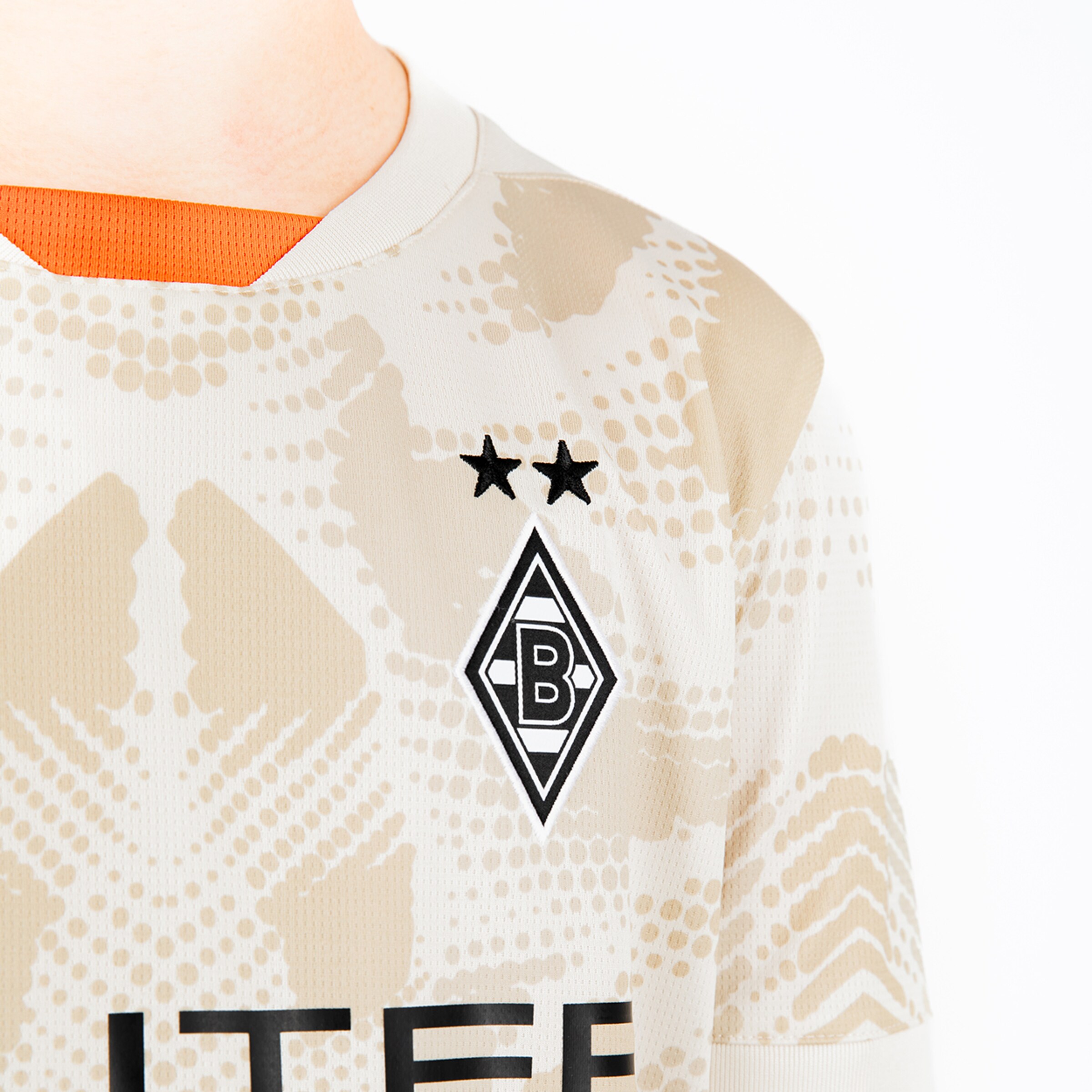 Trikot des Fußballclubs Borussia Mönchengladbach mit Logo und zwei Sternen.