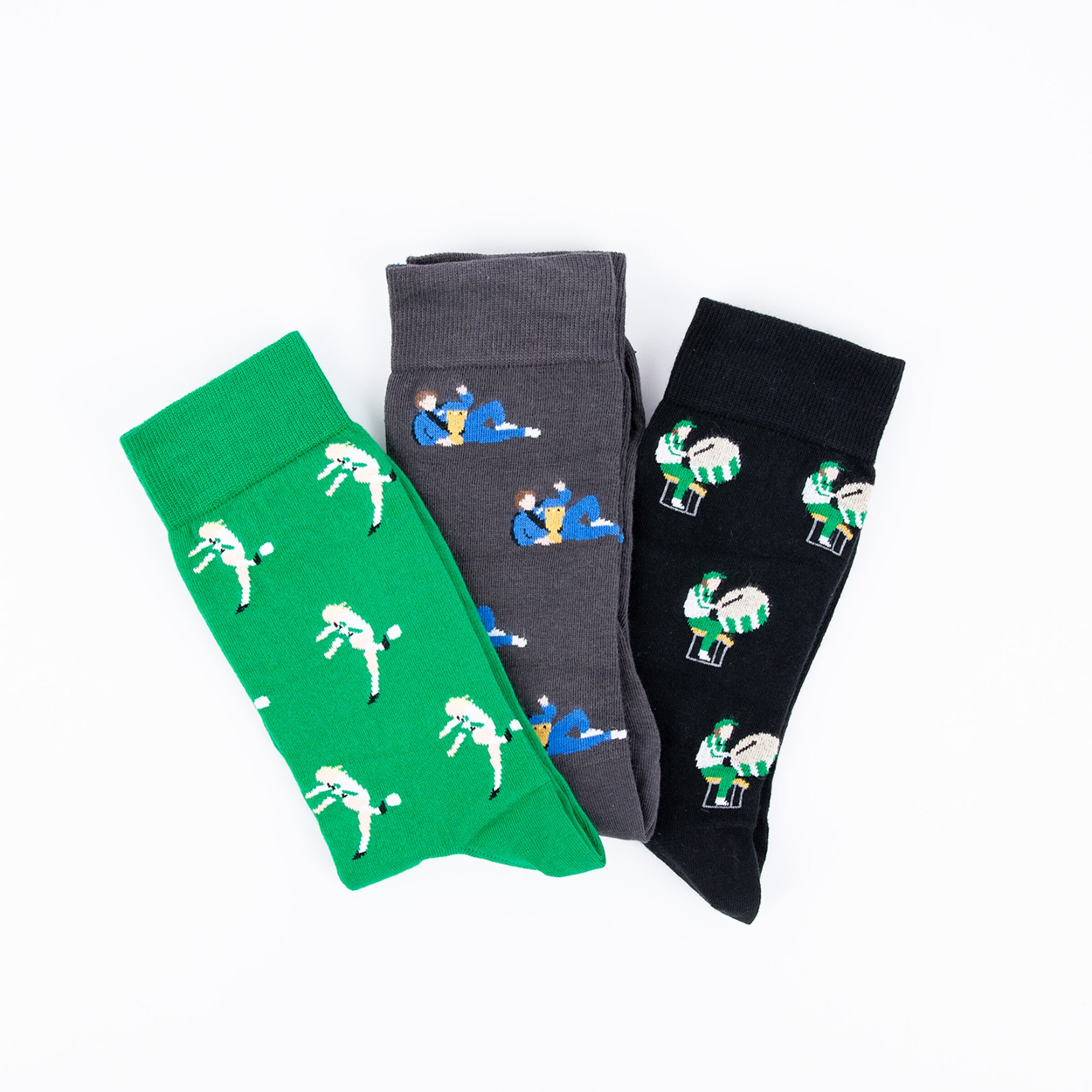 Three pairs of socks in different colors featuring sports-themed designs.