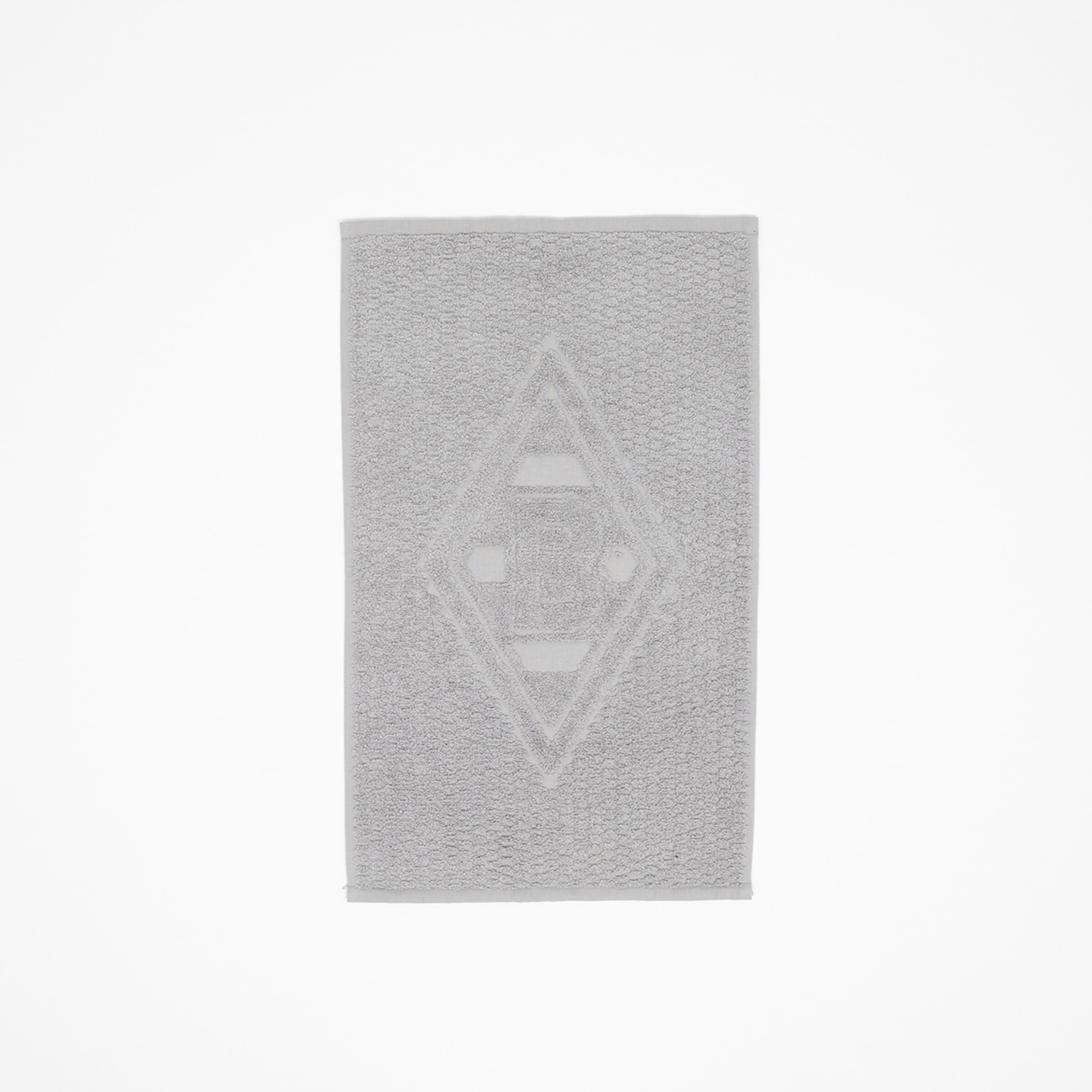 Grau Handtuch mit dem Borussia Mönchengladbach Logo in der Mitte.