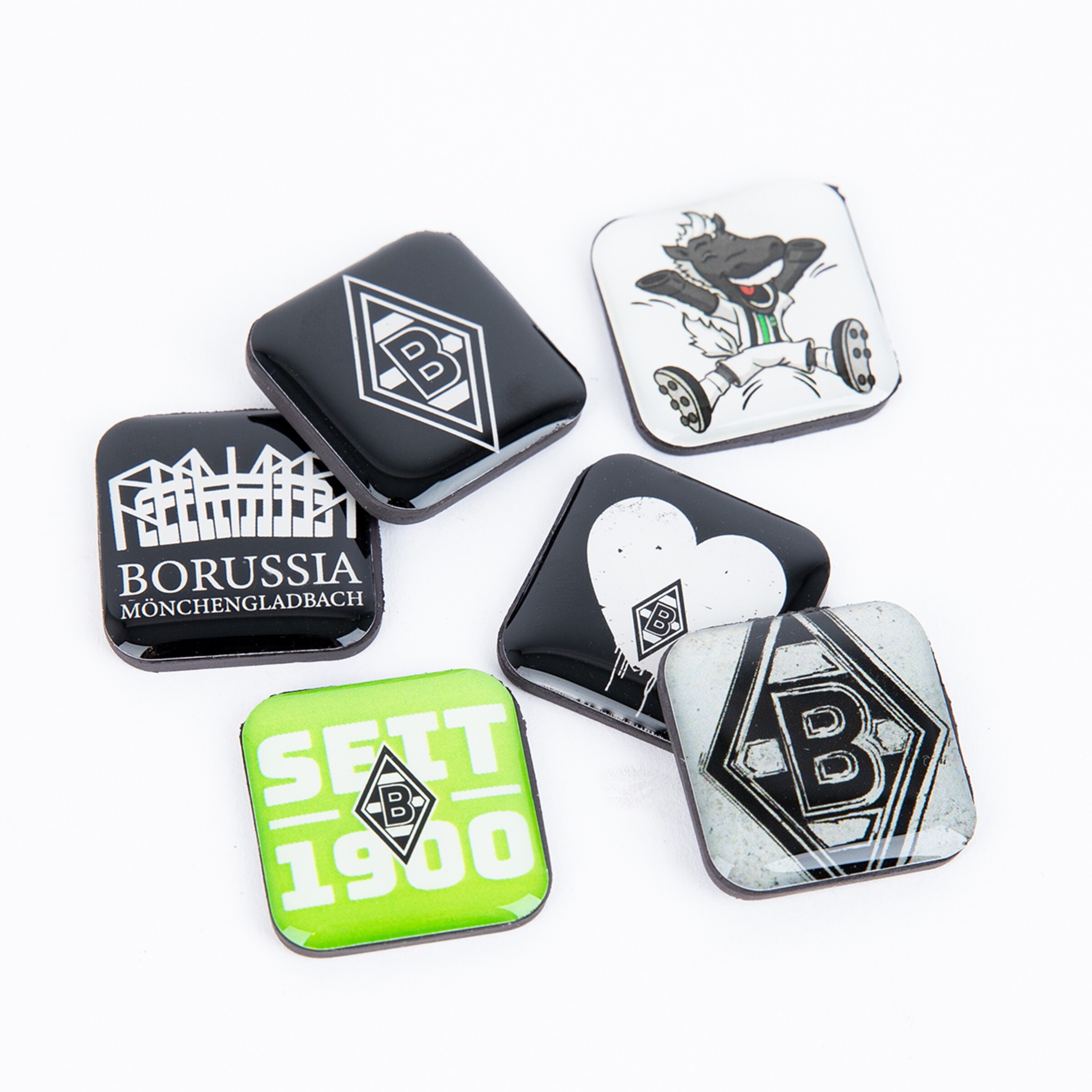 Six square badges featuring various designs including the Borussia Mönchengladbach logo and Jünter.