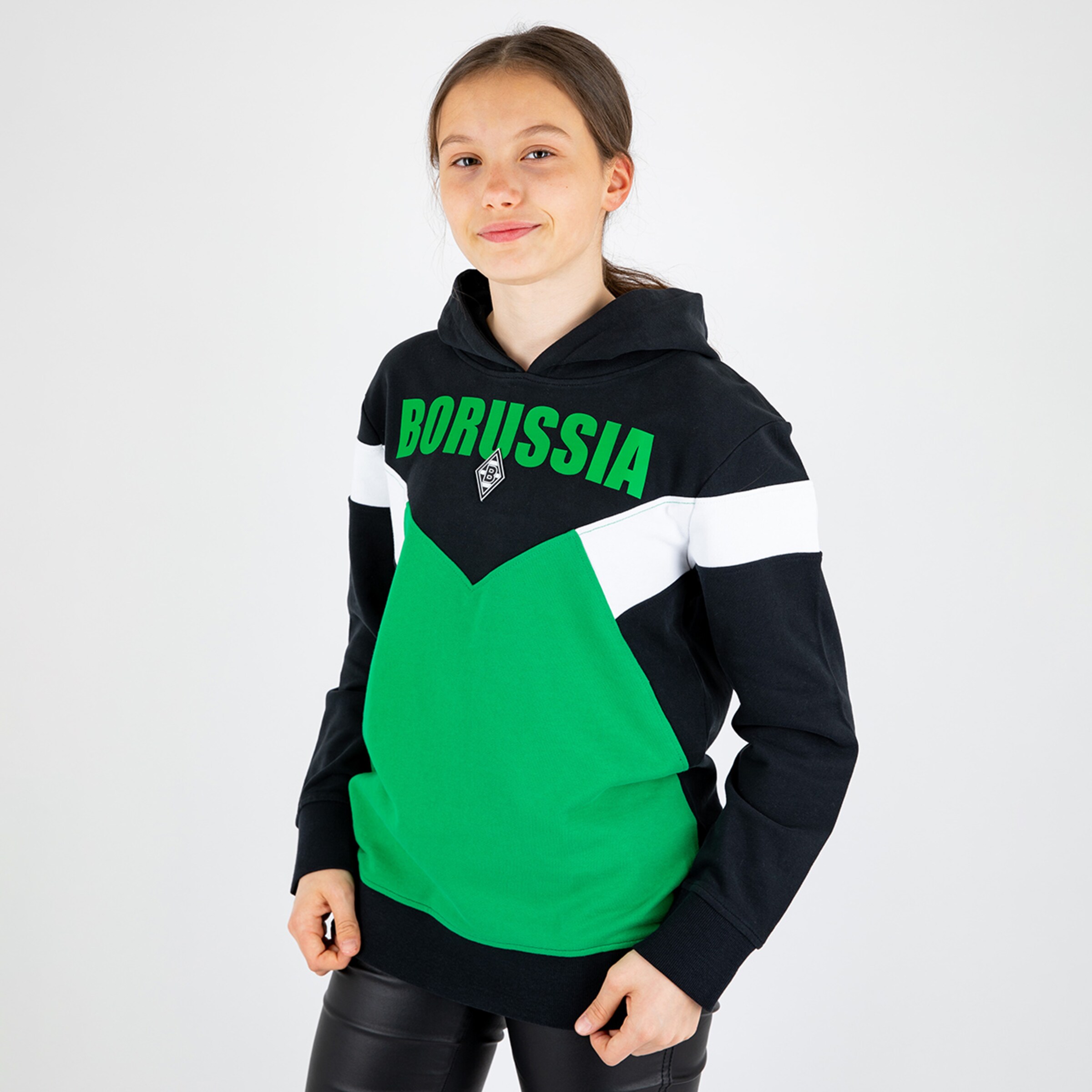 Youth wearing a hoodie with BORUSSIA text and club colors.