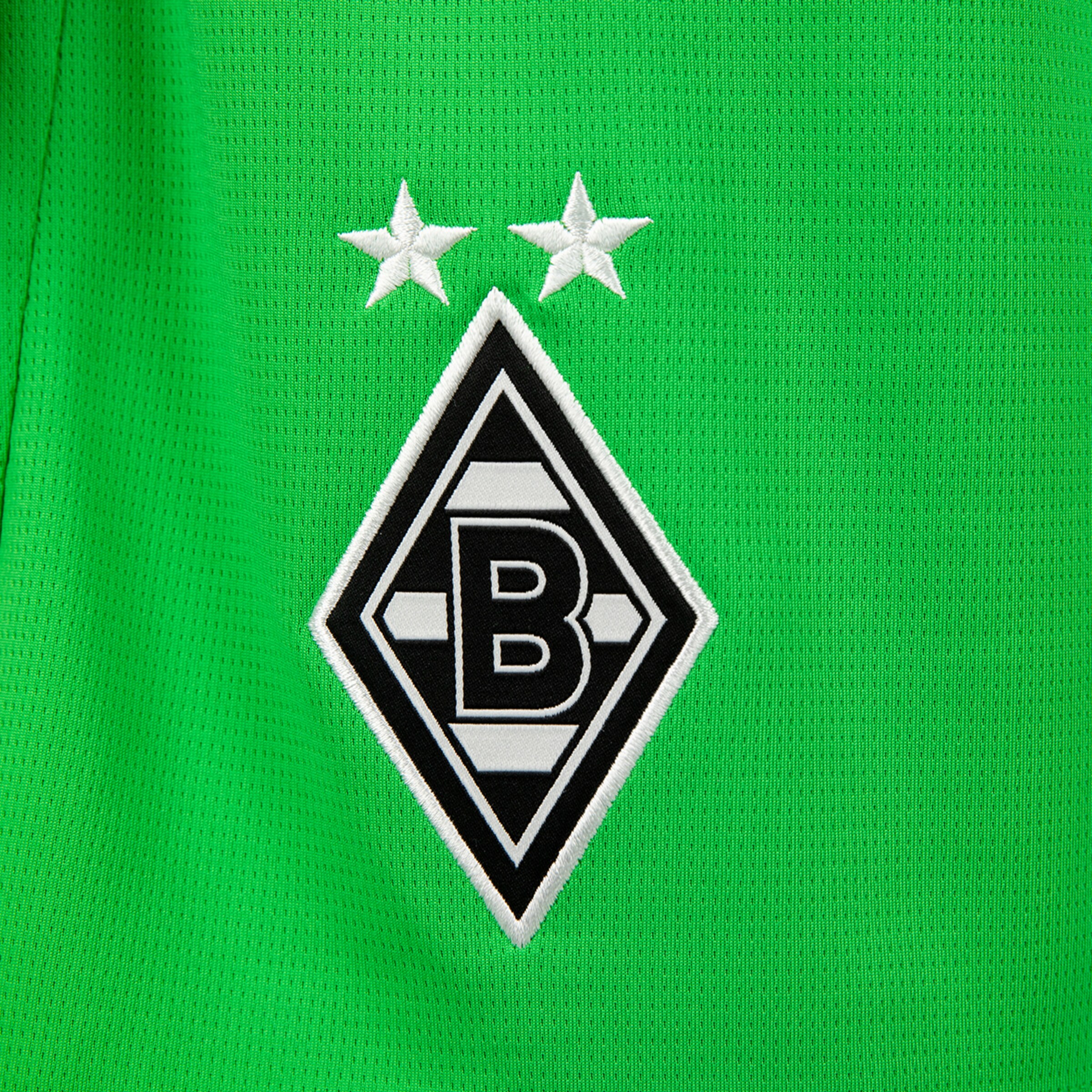 Borussia Mönchengladbach club logo in black and white on green background featuring two stars.