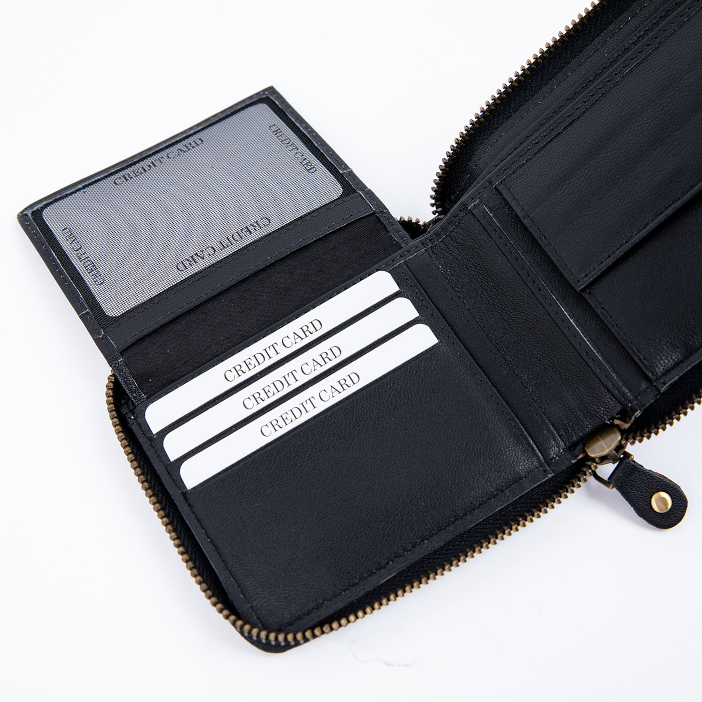 Open black leather zip-around wallet showing card slots and a flip-out ID window with dummy cards on a white background.