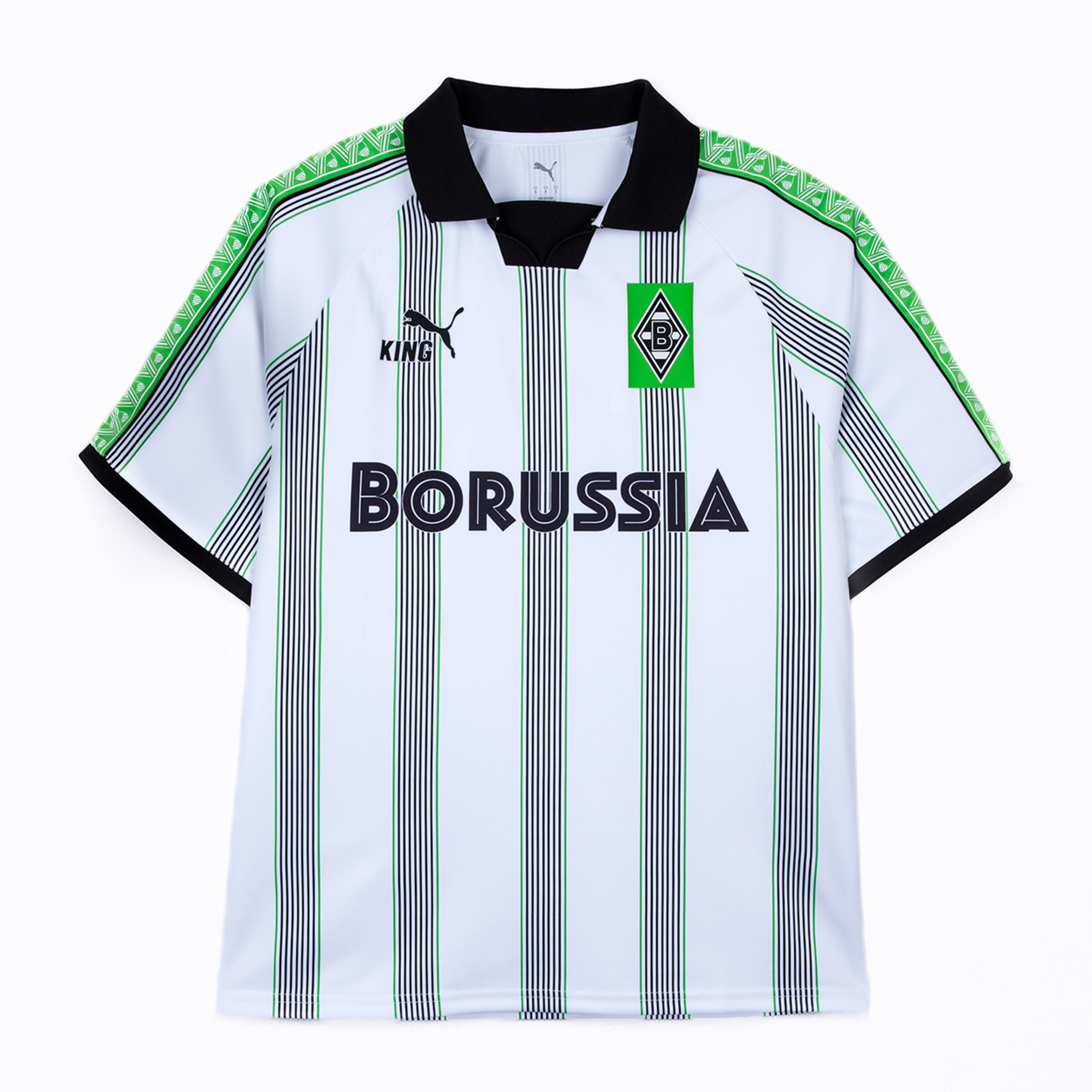White Puma King Borussia Mönchengladbach retro jersey with green stripes, black collar, team crest and bold "BORUSSIA" text on the front.